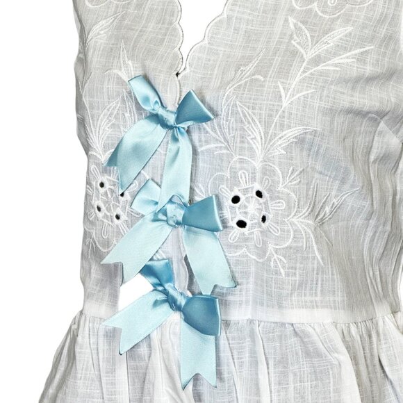 Bow Tie Front Sleeveless Peplum Blouse - Picture 2 of 2